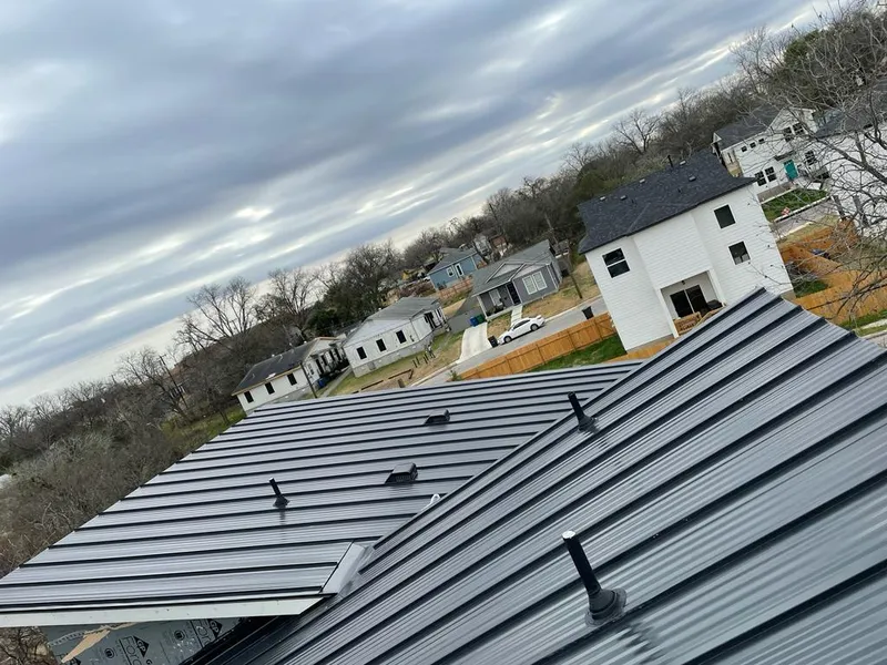 Standing seam metal roof panels with vents for Skylight Repair in Clinton